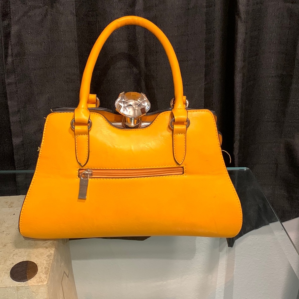 Orange purse with detachable strap